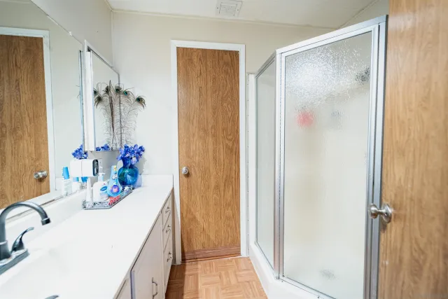 a bath room with a sink and a mirror