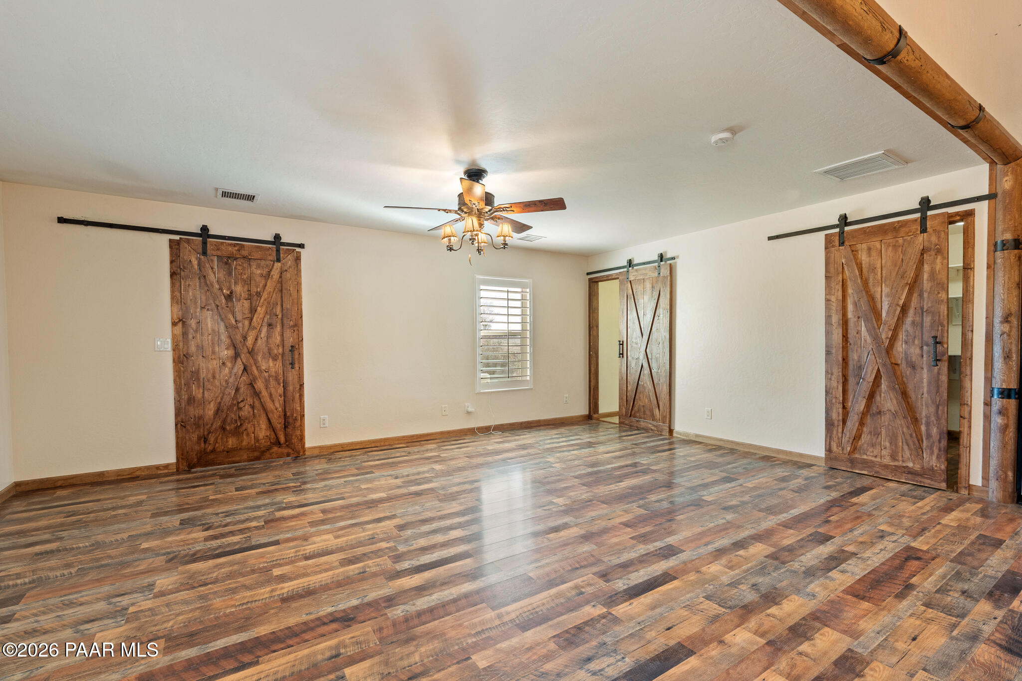 25820 Merlot Lane Paulden, AZ 86334 - Photo 12 of 55 a view of an empty room with window and wooden floor
