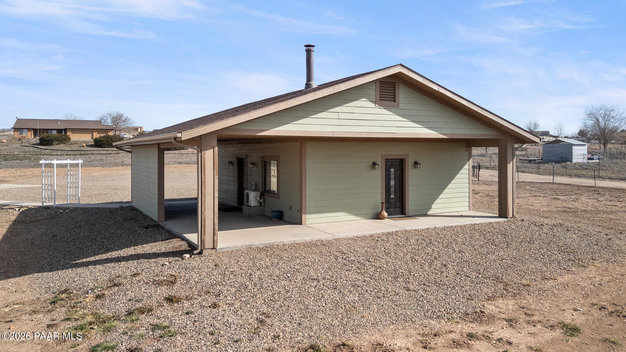 25820 Merlot Lane Paulden, AZ 86334 - Photo 33 of 55 a front view of a house with a yard