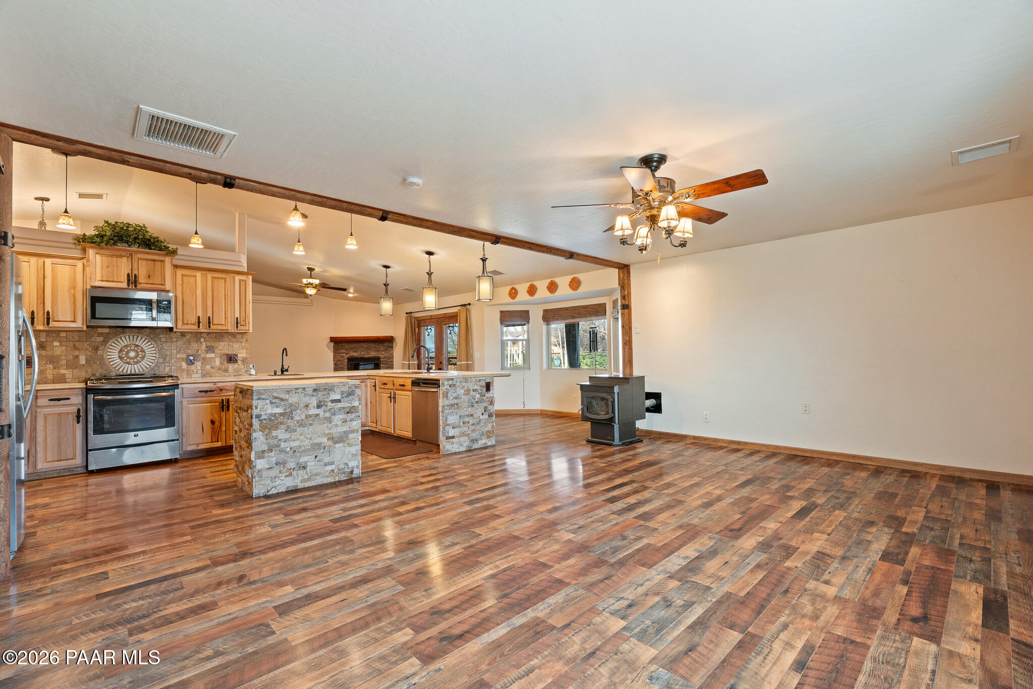 25820 Merlot Lane Paulden, AZ 86334 - Photo 10 of 55 a living room with kitchen island furniture and a ceiling fan