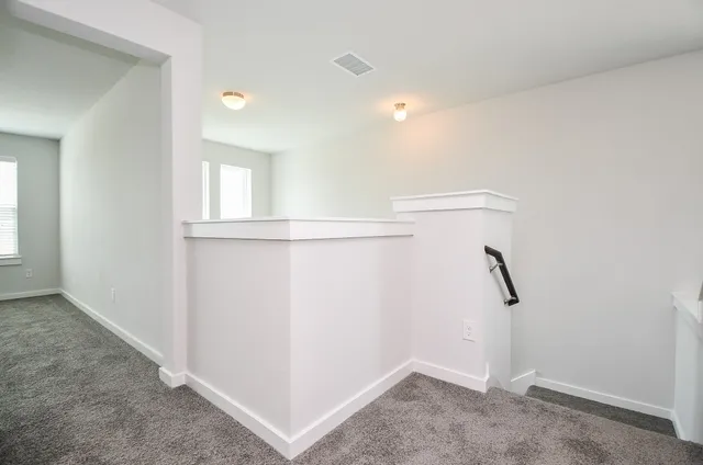 a bathroom with a shower sink and mirror