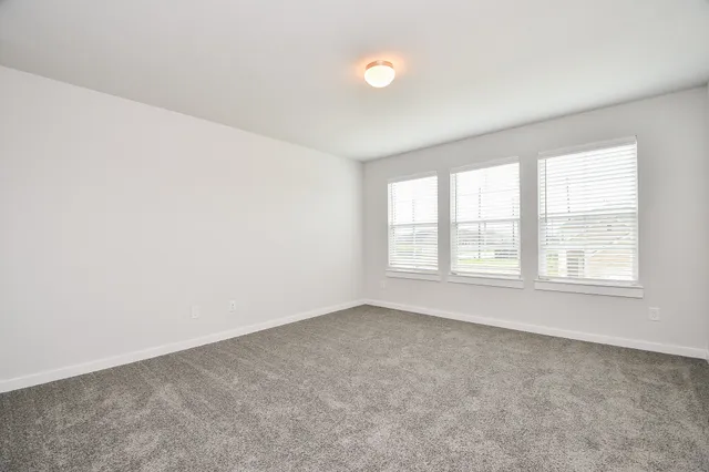 view of a room with wooden floor and staircase