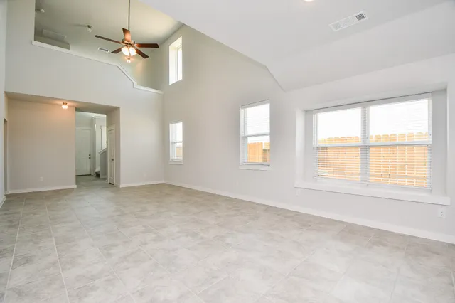a kitchen with granite countertop a sink stove and refrigerator