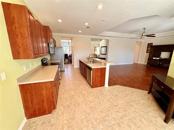 a kitchen with a sink and wooden cabinets