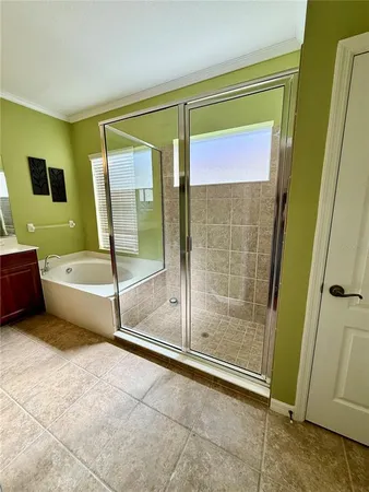 a bathroom with a sink a large mirror and a bathtub