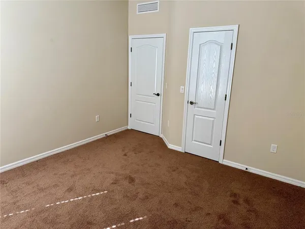 a livingroom with a couch and a workspace