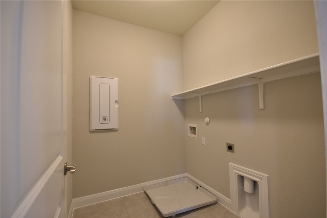 15911 Cessida Street Austin, TX 78728 - Photo 20 of 22 Separate Utility Room Upstairs with Main Bedrooms.