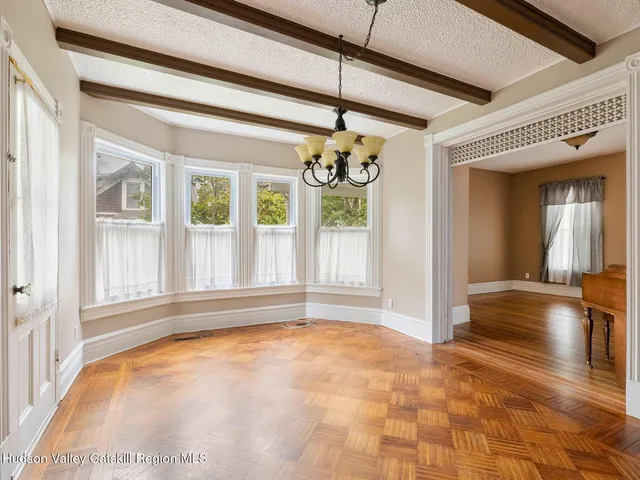 a view of a hallway view with wooden floor and staircase