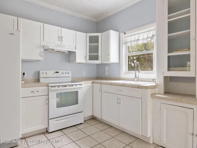 a view of a hallway with closet and front door