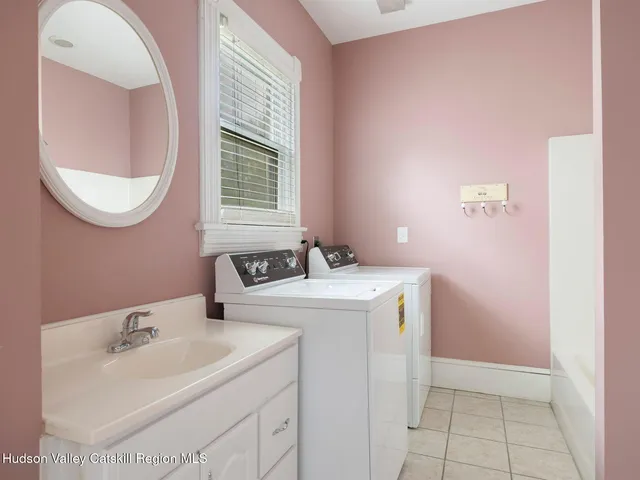 an aerial view of house with yard and lake view