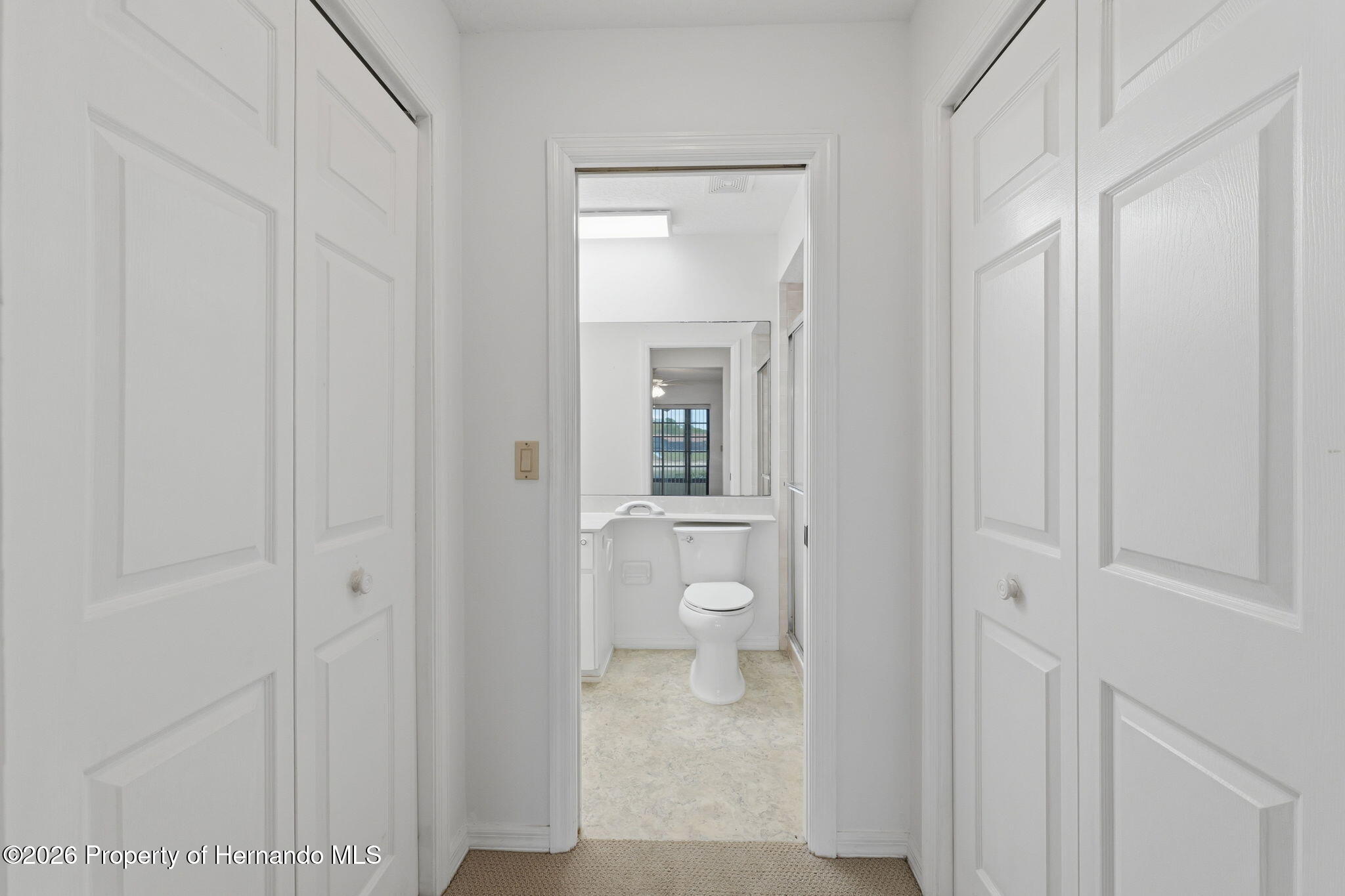 9151 Lingrove Road Weeki Wachee, FL 34613 - Photo 9 of 39 Closets and Primary Bathroom