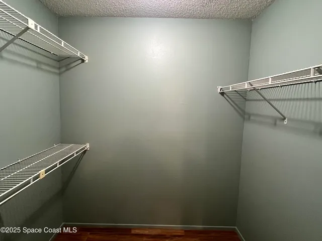 a view of a room with racks on the wall