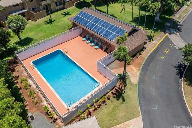 an aerial view of a backyard with outdoor seating