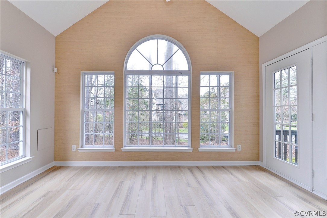 4415 Wind River Run Williamsburg, VA 23188 - Photo 10 of 36 a view of an empty room with wooden floor and a window