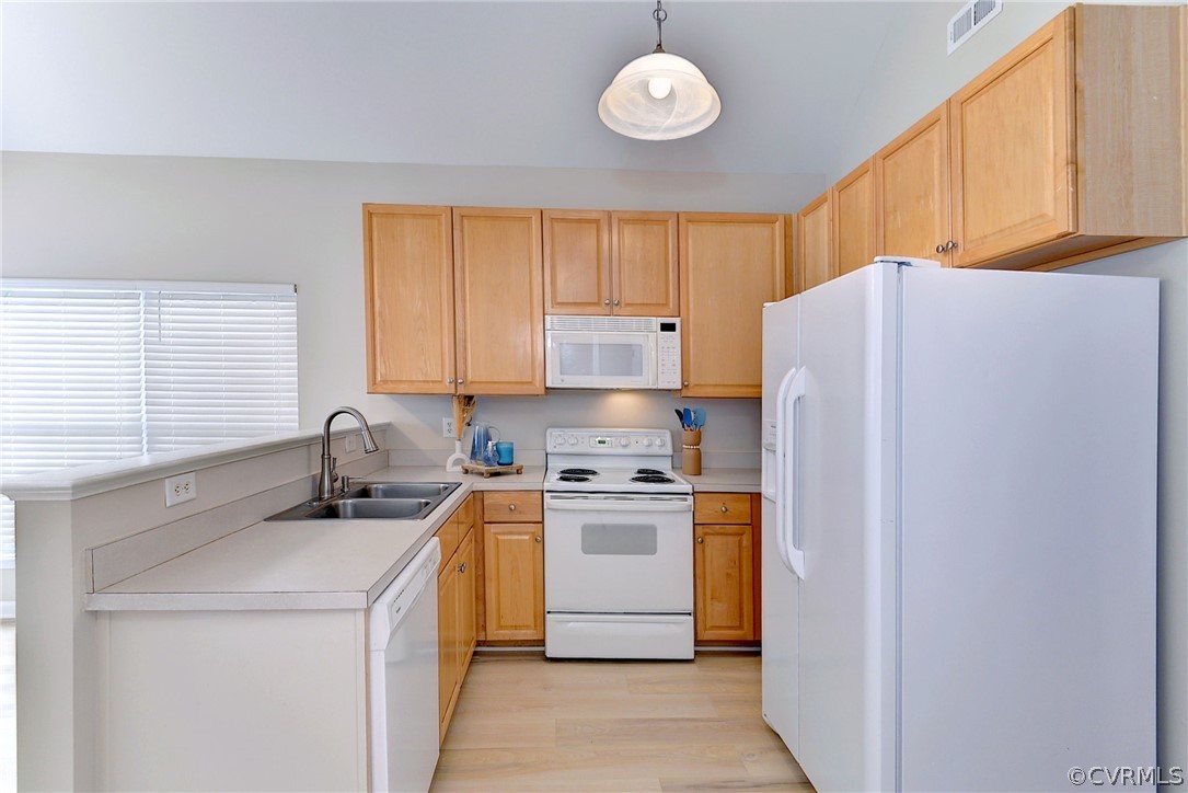 4415 Wind River Run Williamsburg, VA 23188 - Photo 12 of 36 a kitchen with a stove a refrigerator and a sink