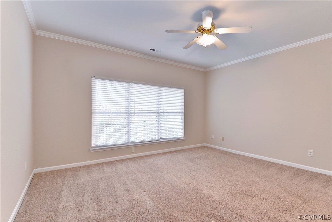 4415 Wind River Run Williamsburg, VA 23188 - Photo 18 of 36 an empty room with chandelier fan and windows