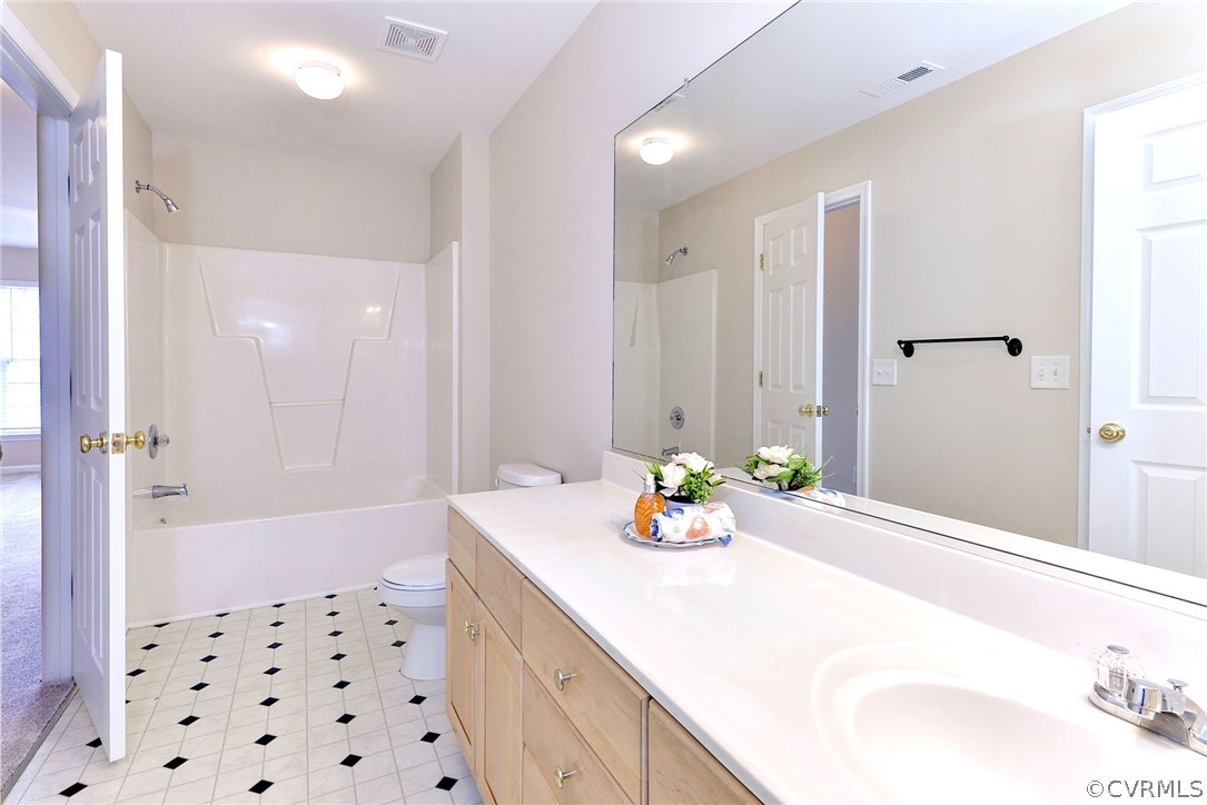 4415 Wind River Run Williamsburg, VA 23188 - Photo 24 of 36 a bathroom with a sink a tub and shower