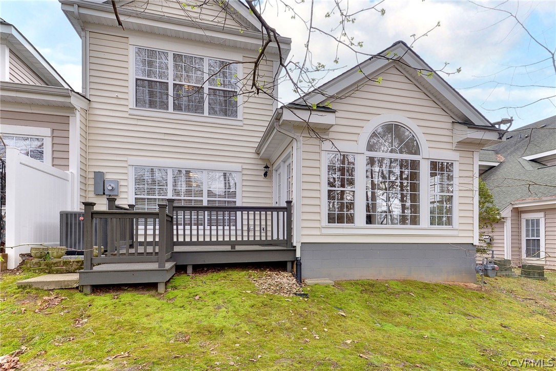 4415 Wind River Run Williamsburg, VA 23188 - Photo 27 of 36 a view of a house with a small yard and deck