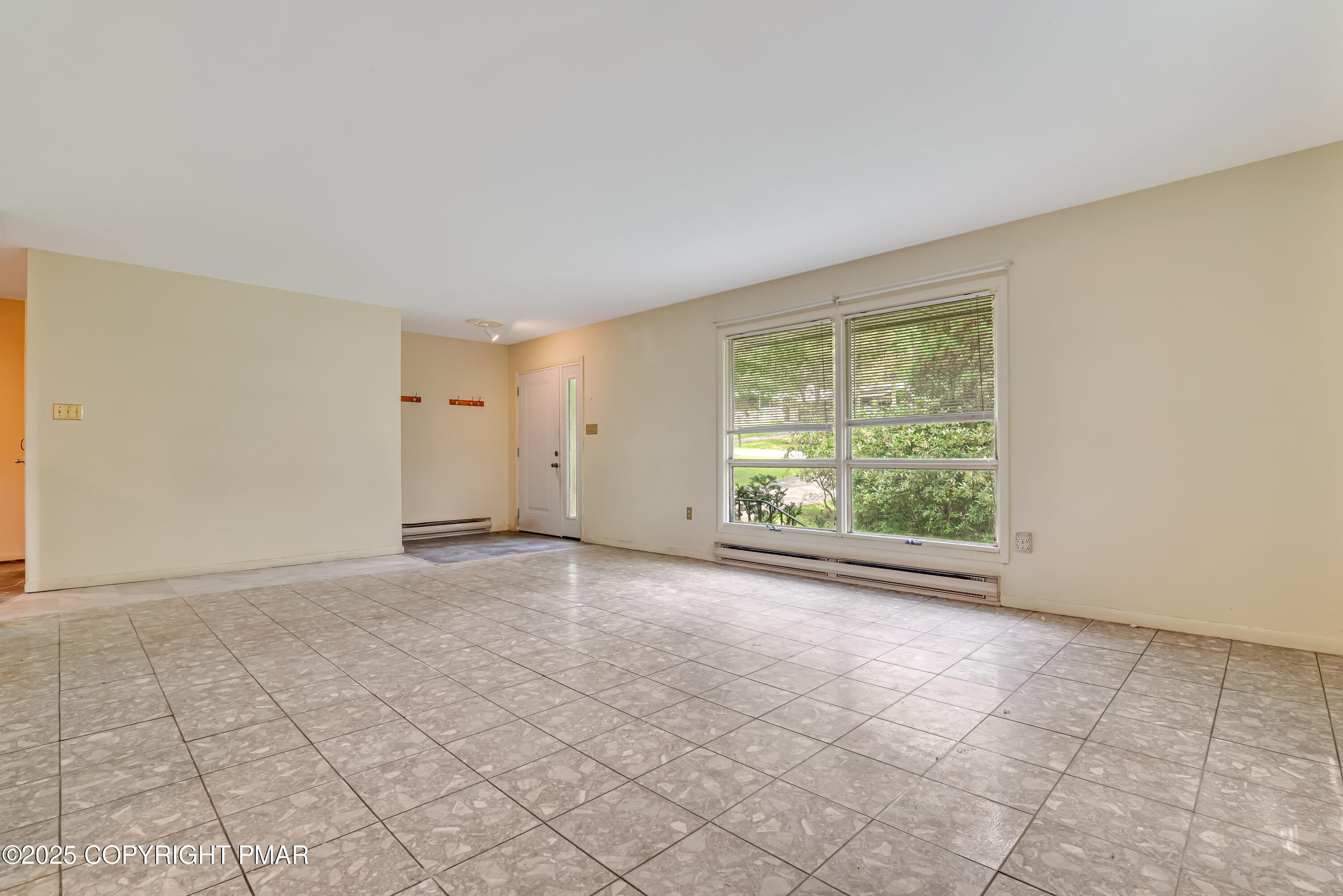 129 Winona Road Mount Pocono, PA 18344 - Photo 12 of 64 a view of an empty room with a window