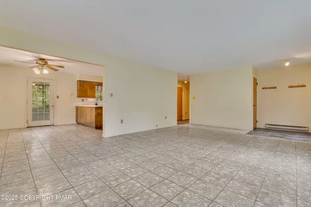 a kitchen with stainless steel appliances a stove a sink and a microwave