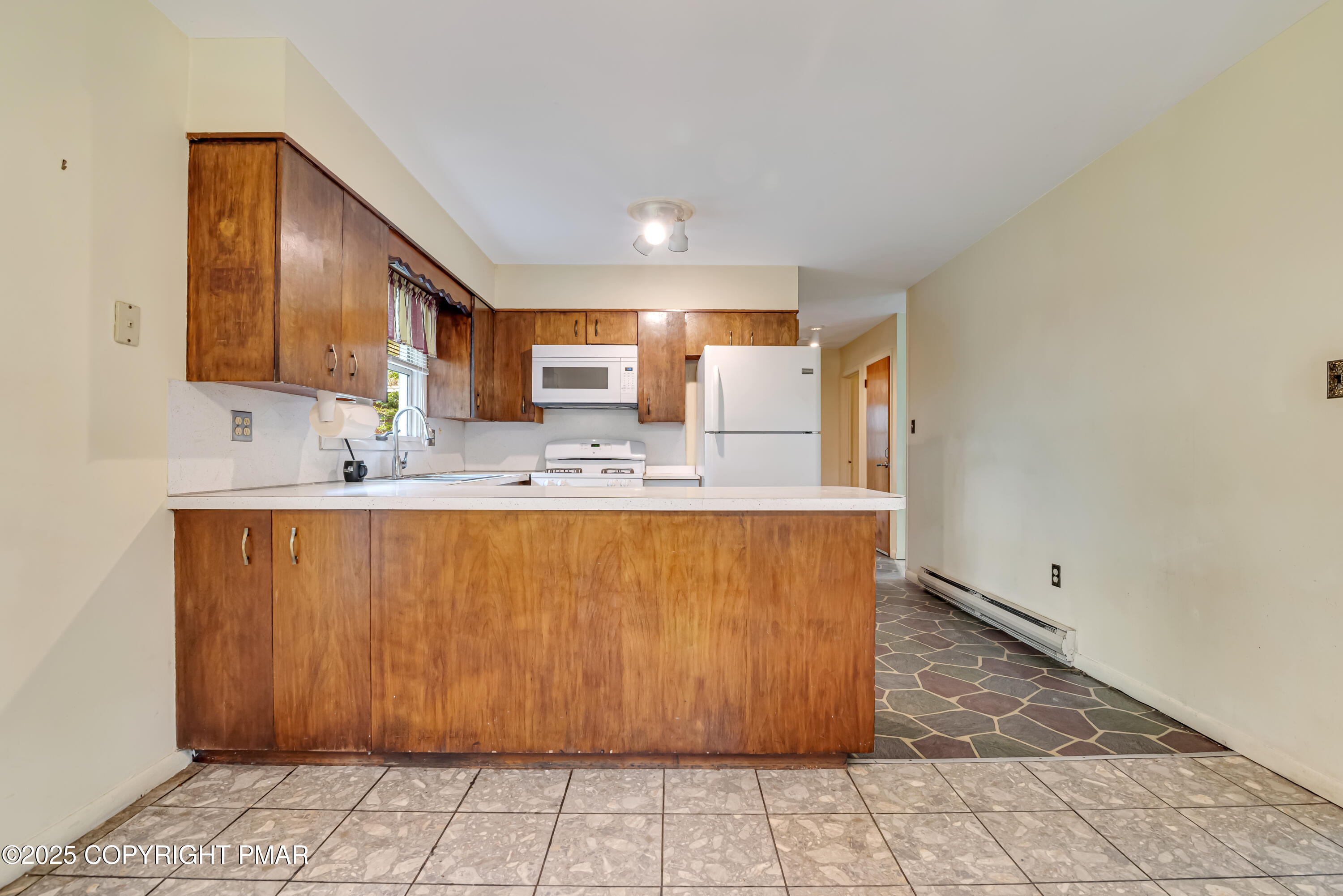129 Winona Road Mount Pocono, PA 18344 - Photo 15 of 64 a large kitchen with stainless steel appliances granite countertop a sink a stove a cabinets and window