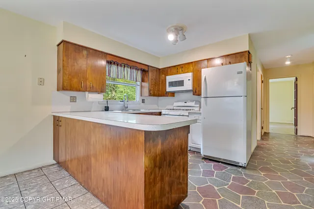 a view of a room with window and wooden floor