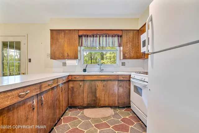 a view of backyard with cabin