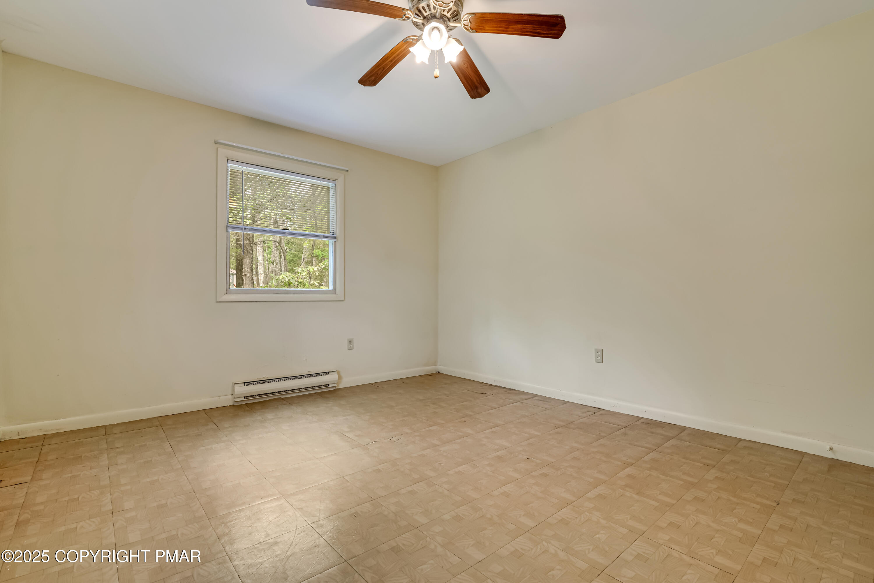 129 Winona Road Mount Pocono, PA 18344 - Photo 25 of 64 an empty room with windows and fan
