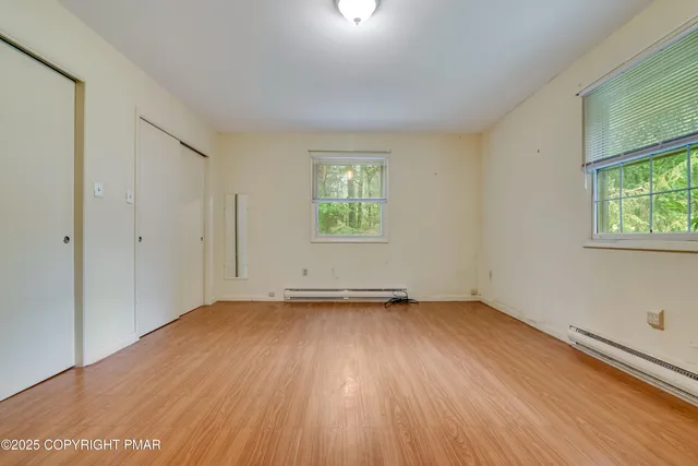 a view of a hallway with an entryway