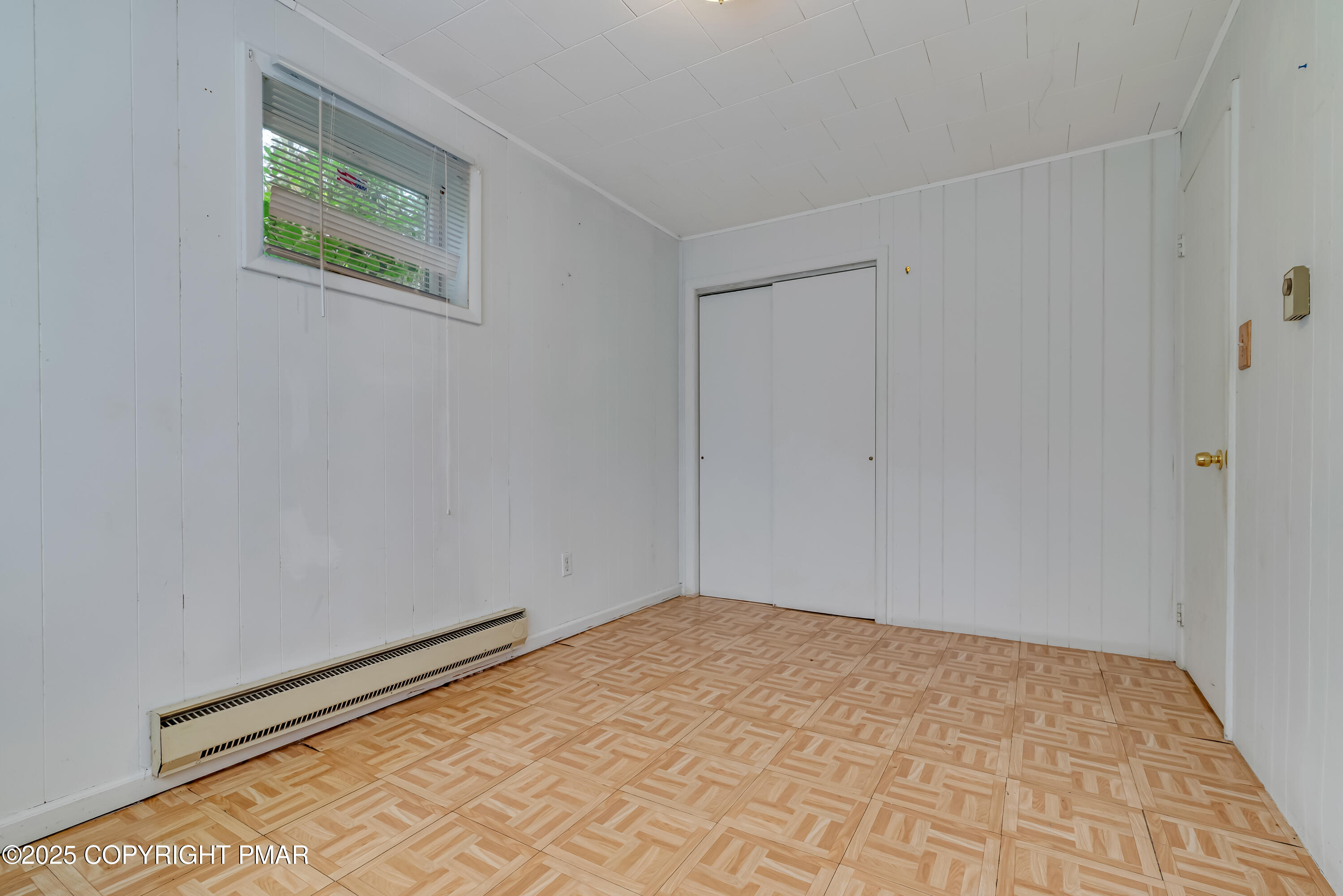 129 Winona Road Mount Pocono, PA 18344 - Photo 41 of 64 a view of a room with a wooden floor and a window