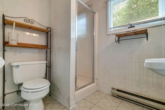 a view of a green field with lots of bushes