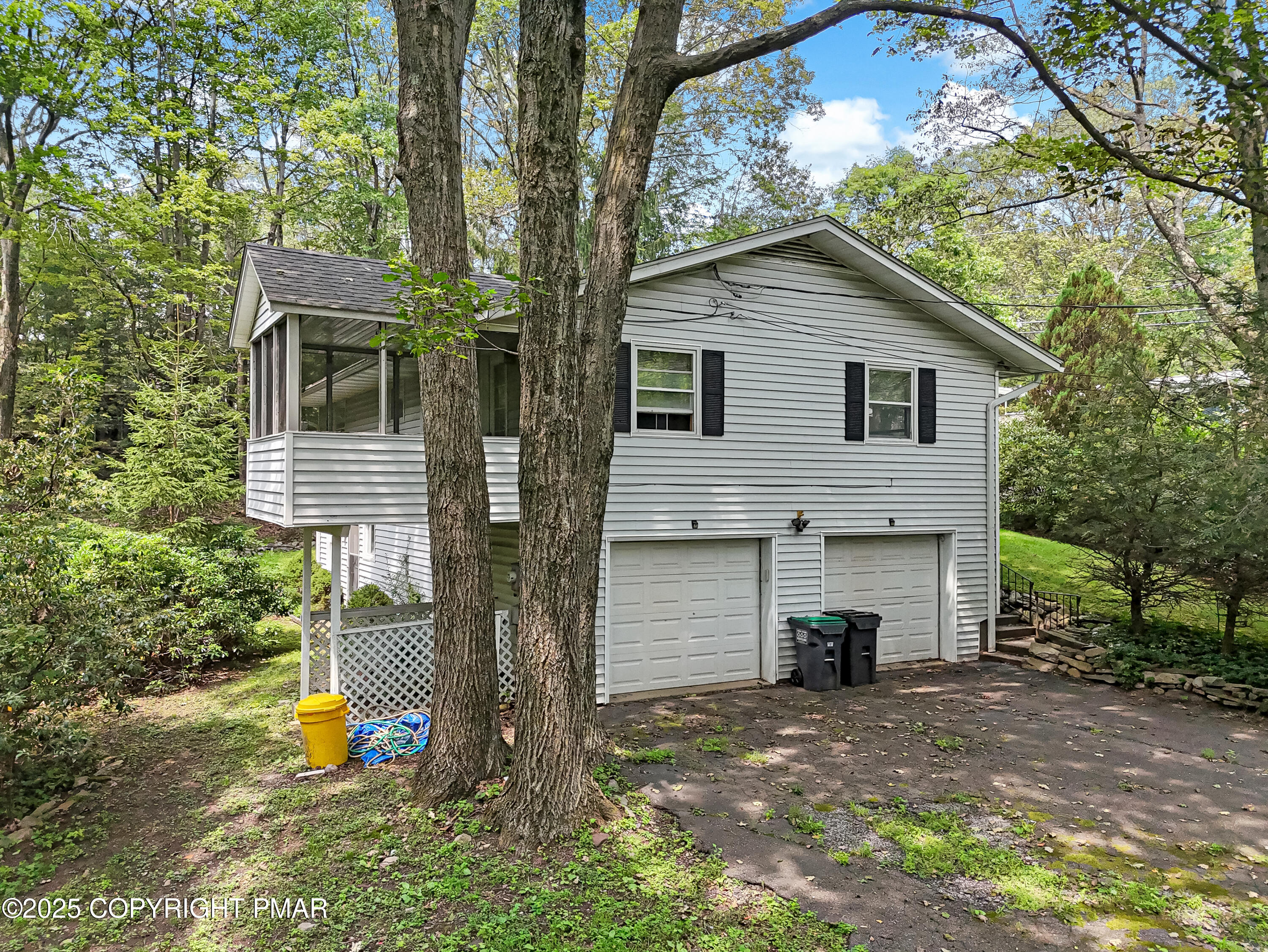 129 Winona Road Mount Pocono, PA 18344 - Photo 48 of 64 a view of a house with a yard and large tree
