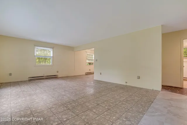 a view of a kitchen with a sink and a window