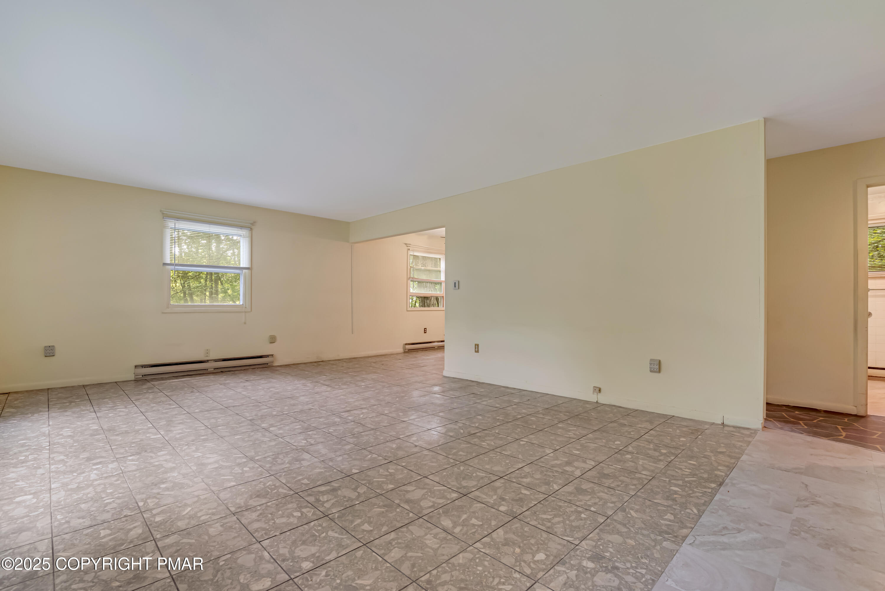 129 Winona Road Mount Pocono, PA 18344 - Photo 5 of 64 an empty room with windows