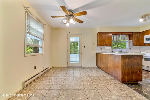a kitchen with stainless steel appliances a refrigerator sink and cabinets