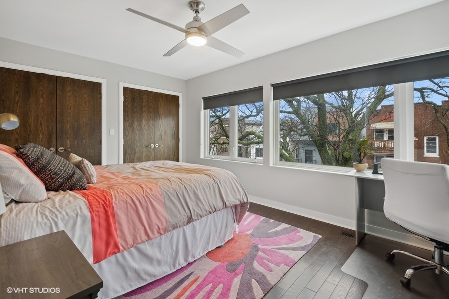 1745 North Troy Street Chicago, IL 60647 - Photo 12 of 29 a bedroom with a large bed and a window