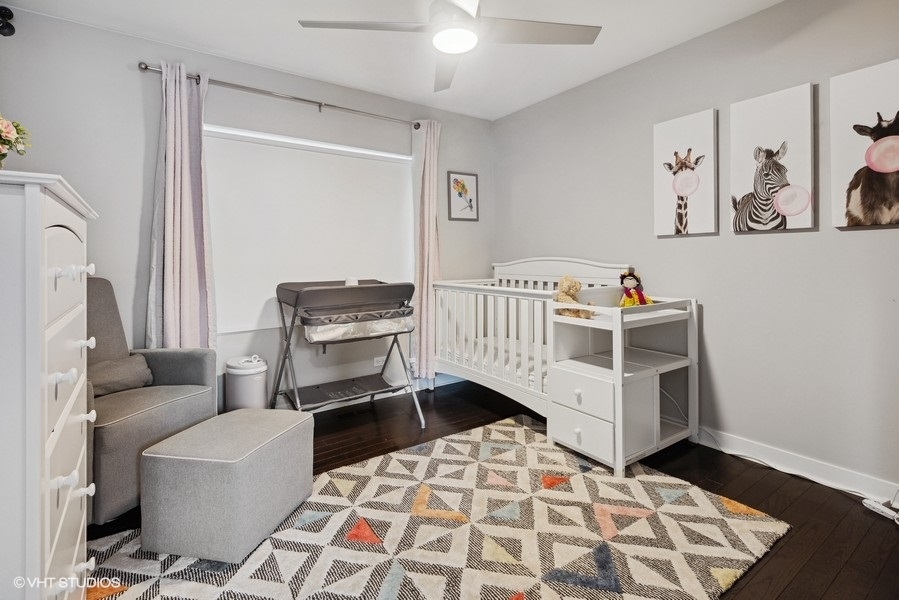 1745 North Troy Street Chicago, IL 60647 - Photo 13 of 29 a bedroom with furniture and a window