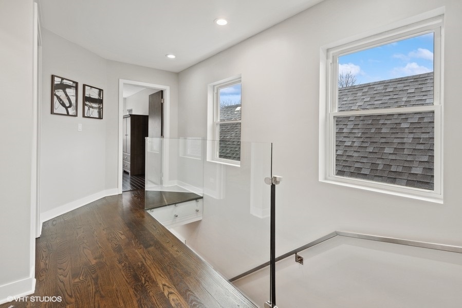 1745 North Troy Street Chicago, IL 60647 - Photo 16 of 29 a view of an empty room with window and wooden floor