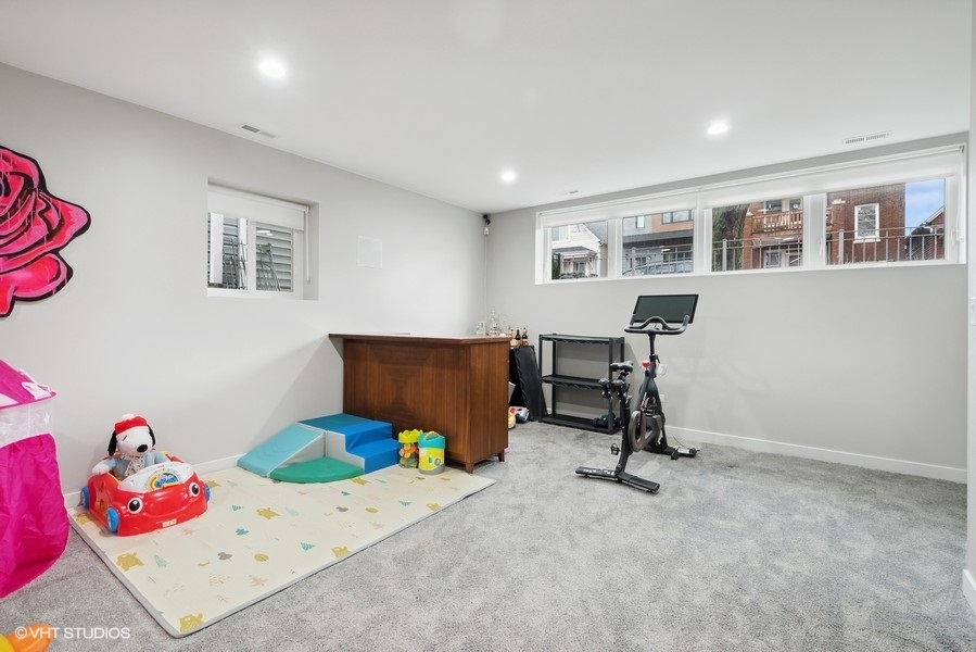 1745 North Troy Street Chicago, IL 60647 - Photo 17 of 29 a view of a bedroom with baby toys
