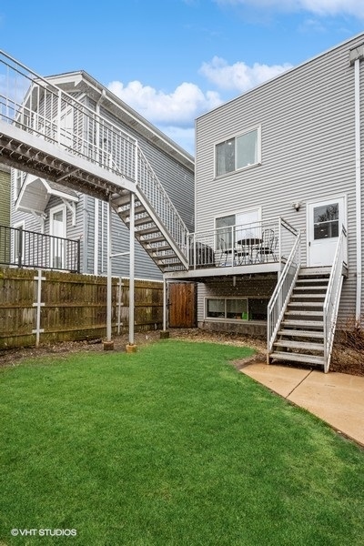 1745 North Troy Street Chicago, IL 60647 - Photo 22 of 29 a view of a house with a yard