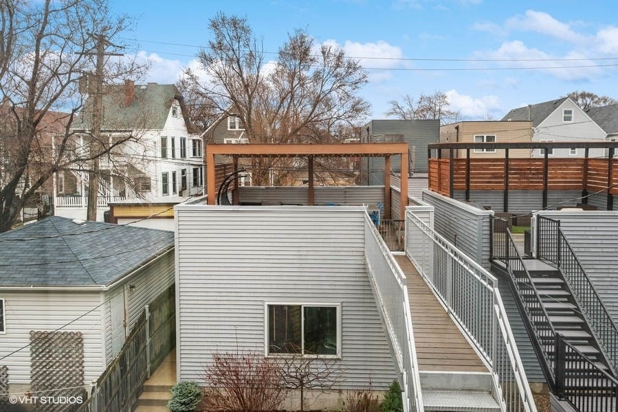 1745 North Troy Street Chicago, IL 60647 - Photo 23 of 29 a view of a house with many windows