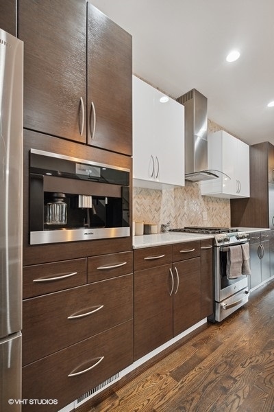 1745 North Troy Street Chicago, IL 60647 - Photo 7 of 29 a kitchen with granite countertop white cabinets and stainless steel appliances