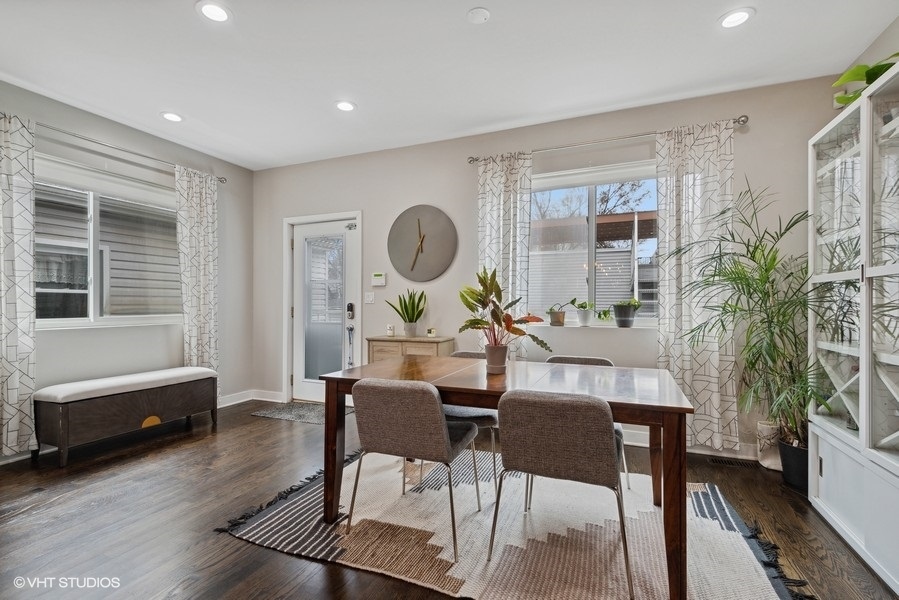 1745 North Troy Street Chicago, IL 60647 - Photo 8 of 29 a living room with furniture a large window and a wooden floor