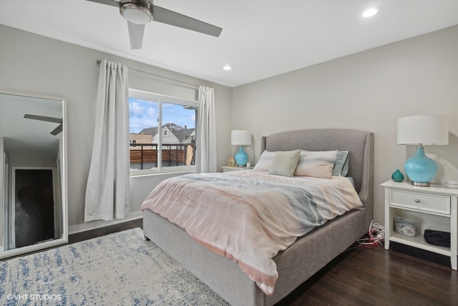 1745 North Troy Street Chicago, IL 60647 - Photo 9 of 29 a bedroom with a bed and a window