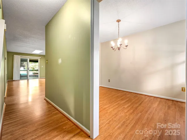 a view of a room with wooden floor and staircase