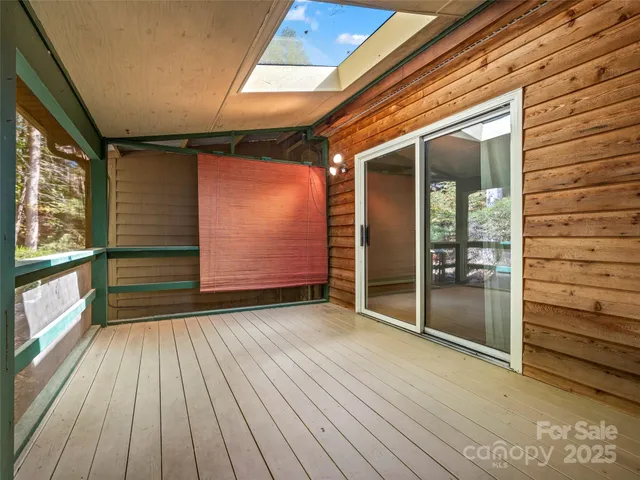 a view of outdoor space and wooden floor