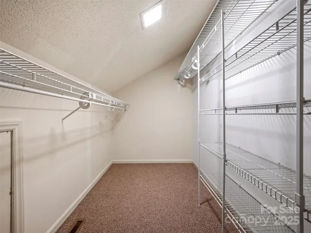 a view of a room with racks on the wall