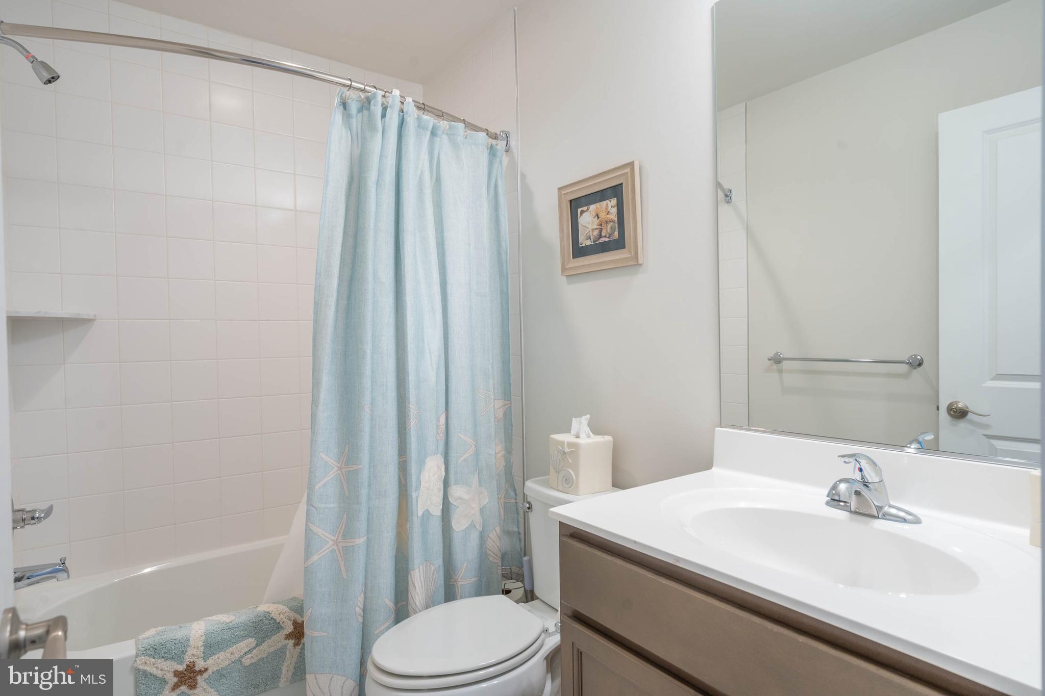 18565 Emerson Way Georgetown, DE 19947 - Photo 27 of 60 a bathroom with a sink a toilet and shower