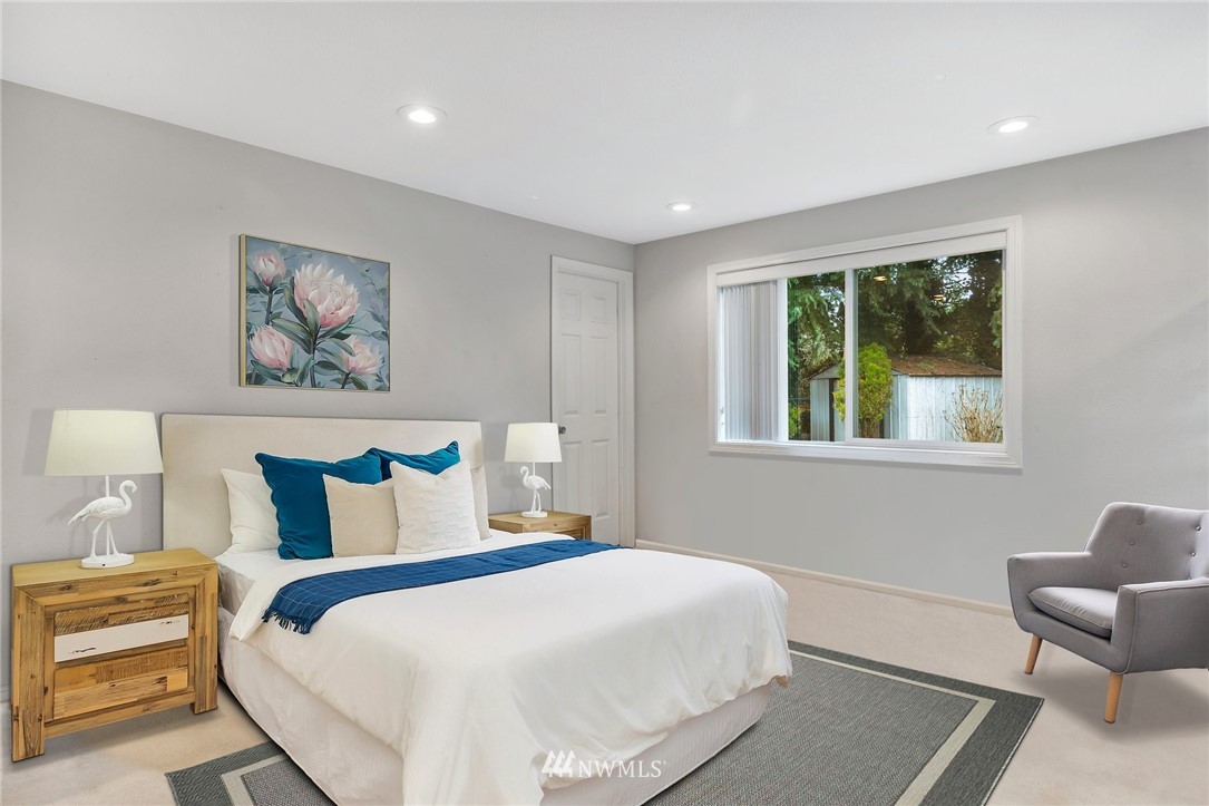 17827 Brook Boulevard Bothell, WA 98012 - Photo 20 of 38 a bedroom with a bed and a painting on the wall