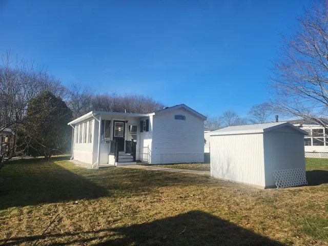 a view of a backyard of the house
